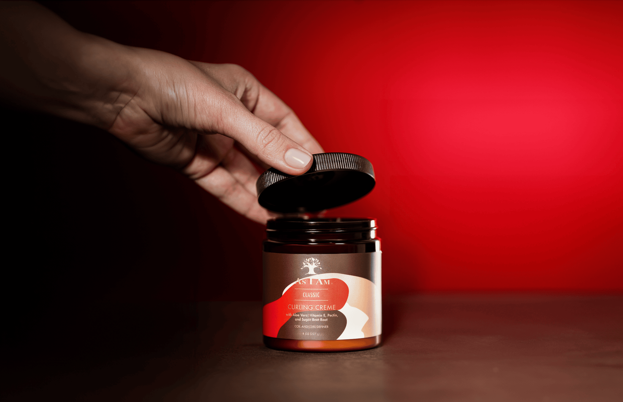 As I Am Curling Cream im Tiegel - eine reichhaltige Stylingcreme, die Locken definiert, Feuchtigkeit spendet und sanften Halt für natürlich strukturiertes Haar bietet.