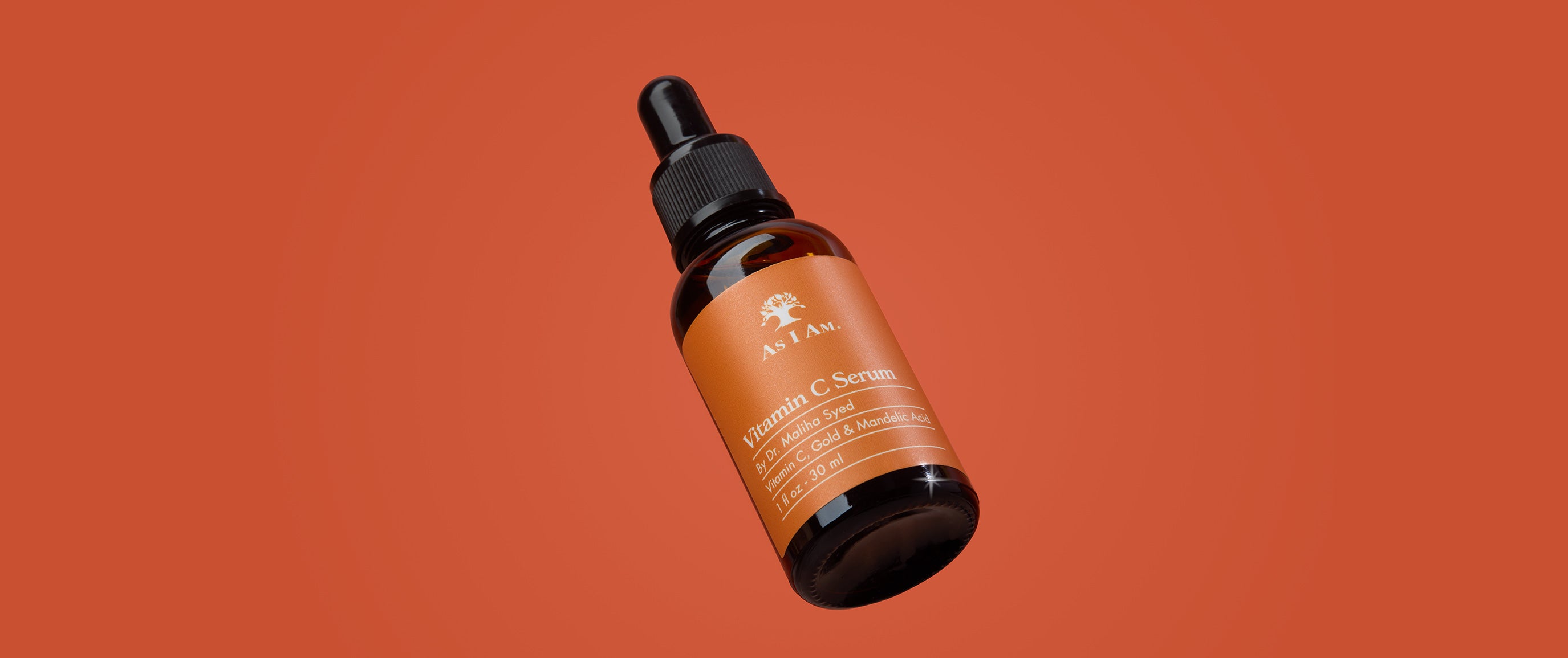 Flasche mit Tropfer auf orangefarbenem Hintergrund