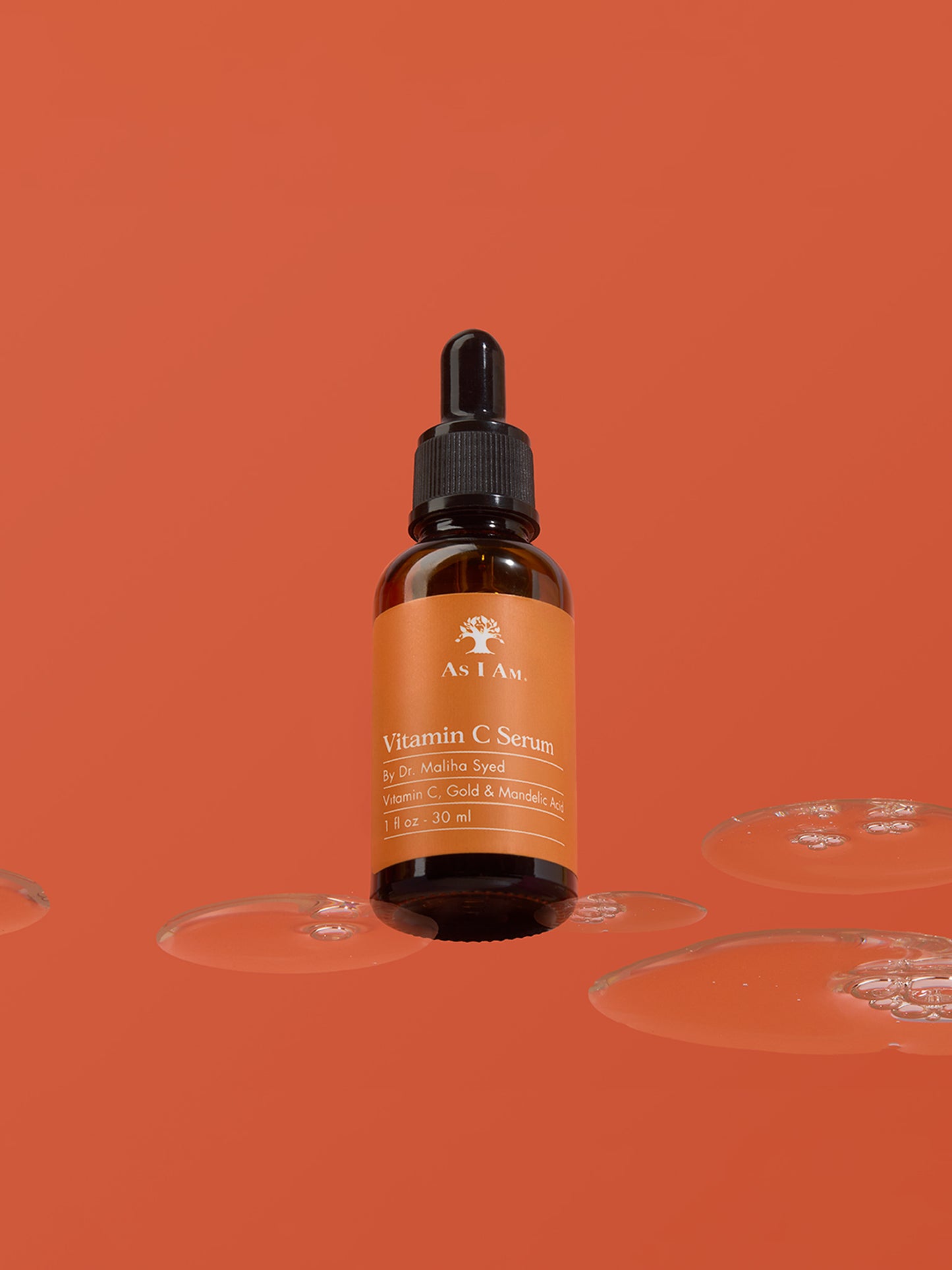 Vitamin-C-Serumflasche mit Tropfer auf orangefarbenem Hintergrund