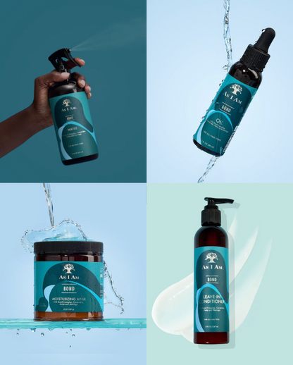 Kollektion der Haarpflegeprodukte „As I Am“ mit Spray, Öl, Balsam und Leave-in-Conditioner mit Wassertropfen und Spritzern.